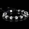 Lukze 925 sterling silver skull and black onyx macramé bracelet on a black reflective surface