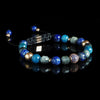 Lukze Chefchaouen Macramé Bracelet with blue lapis lazuli and gold accents on black background