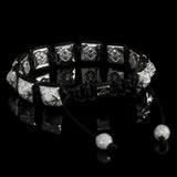 Stargazer Shamballa Bracelet by Lukze featuring silver fleur-de-lis beads on a black cord.