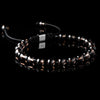 Lukze Onyx and Smokey Quartz macramé bracelet with 925 silver bead on black background